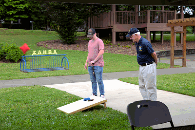 Council Mascot Jordan Bowman teamed with Program Director Bob Hall, note incoming red bag!